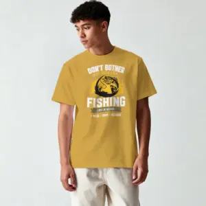 Don't Bother I'm Fishing 180 GSM premium graphic T-shirt featuring a fishing-themed design on a mustard yellow tee.
